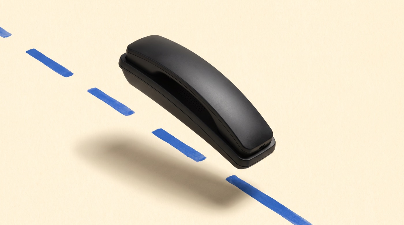 A handset on paper beside a runway centreline, the product image